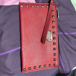 Red studded Michael Kors wristlet